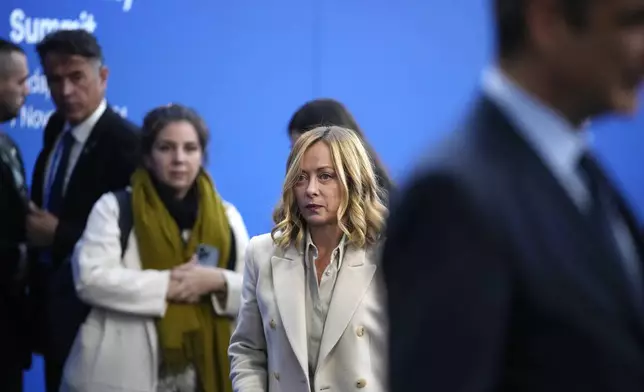 Italy's Prime Minister Giorgia Meloni, center, arrives for the European Political Community (EPC) Summit at the Puskas Arena in Budapest, Hungary, Thursday, Nov. 7, 2024. (AP Photo/Petr Josek)