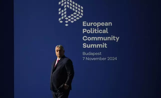 Hungary's Prime Minister Viktor Orban waits for the arrival of leaders for the European Political Community (EPC) Summit at the Puskas Arena in Budapest, Hungary, Thursday, Nov. 7, 2024. (AP Photo/Petr David Josek)