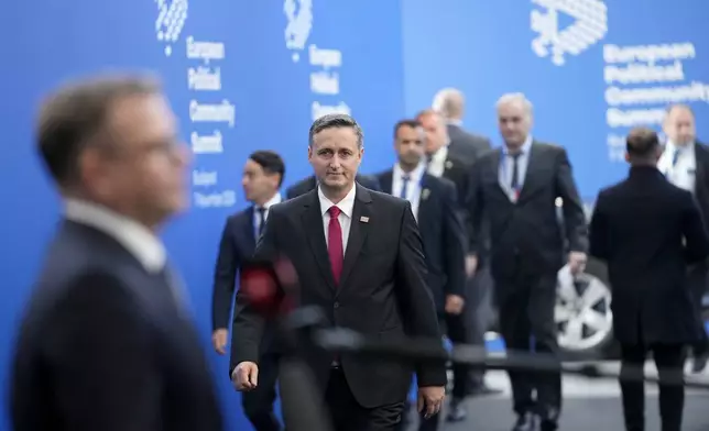 Chairman of the Presidency of Bosnia and Herzegovina Denis Becirovic, center, arrives for the European Political Community (EPC) Summit at the Puskas Arena in Budapest, Hungary, Thursday, Nov. 7, 2024. (AP Photo/Petr Josek)