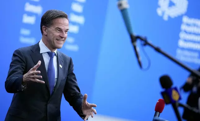 NATO Secretary General Mark Rutte speaks with the media as he arrives for the European Political Community (EPC) Summit at the Puskas Arena in Budapest, Hungary, Thursday, Nov. 7, 2024. (AP Photo/Petr Josek)