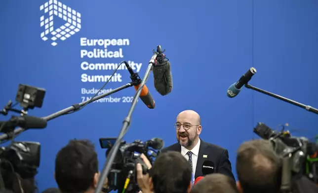 European Council President Charles Michel speaks with the media as he arrives for the European Political Community (EPC) Summit at the Puskas Arena in Budapest, Thursday, Nov. 7, 2024. (AP Photo/Denes Erdos)