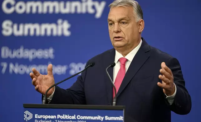 Hungary's Prime Minister Viktor Orban gestures during a press conference during the European Political Community (EPC) Summit at the Puskas Arena in Budapest , Hungary, Thursday, Nov. 7, 2024. (AP Photo/Denes Erdos)