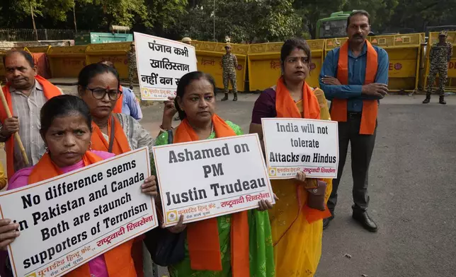 Activists of United Hindu Front, a right wing group reacting to Canada’s allegation that Indian Home Minister Amit Shah ordered the targeting of Sikh activists inside Canada, hold placards during a protest in New Delhi, India, Tuesday, Nov. 5, 2024. (AP Photo/Manish Swarup)