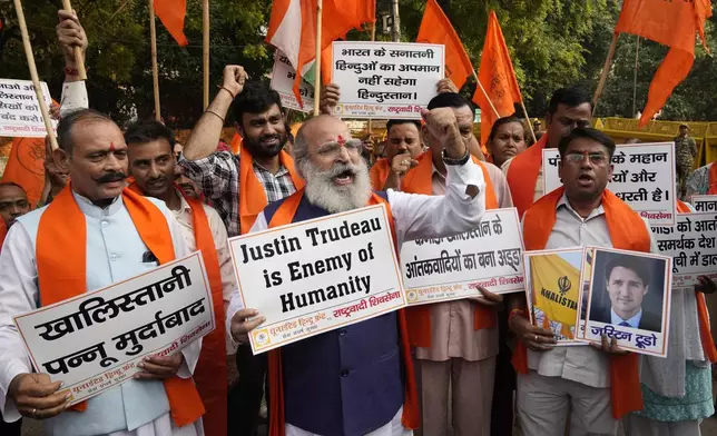 Activists of United Hindu Front, a right wing group reacting to Canada’s allegation that Indian Home Minister Amit Shah ordered the targeting of Sikh activists inside Canada, hold placards during a protest in New Delhi, India, Tuesday, Nov. 5, 2024. (AP Photo/Manish Swarup)