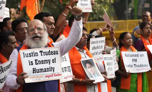 Activists of United Hindu Front, a right wing group reacting to Canada’s allegation that Indian Home Minister Amit Shah ordered the targeting of Sikh activists inside Canada, hold placards during a protest in New Delhi, India, Tuesday, Nov. 5, 2024. (AP Photo/Manish Swarup)