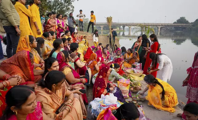 Hindu devotees perform rituals during Chhath festival performed to thank the Sun god for sustaining life on earth and seeking the divine blessings on the Gomti River in Lucknow, India, Thursday, Nov. 7, 2024. (AP Photo/Rajesh Kumar Singh)