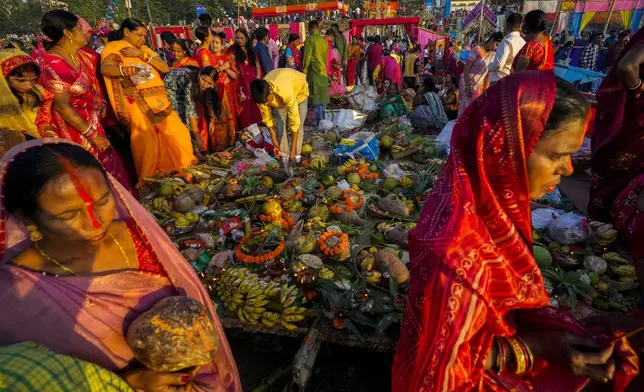 Hindu devotees gather by the river Brahmaputra and offer prayers during Chhath festival in Guwahati, northeastern Assam state, India, Thursday, Nov. 7, 2024. (AP Photo/Anupam Nath)