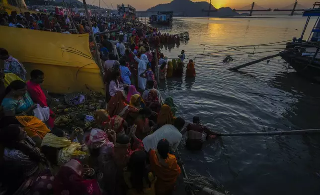 Hindu devotees gather by the river Brahmaputra and offer prayers during Chhath festival in Guwahati, northeastern Assam state, India, Thursday, Nov. 7, 2024. (AP Photo/Anupam Nath)