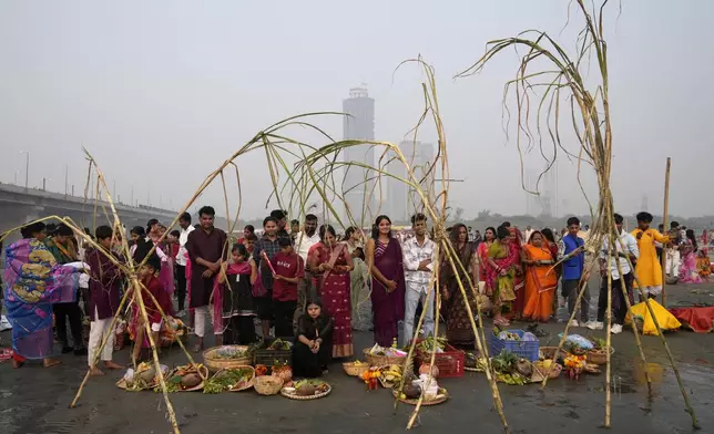 Devotees pray on the banks of the river Yamuna during Chhath festival in Noida, near New Delhi, India, Thursday, Nov. 7, 2024. (AP Photo/Manish Swarup)