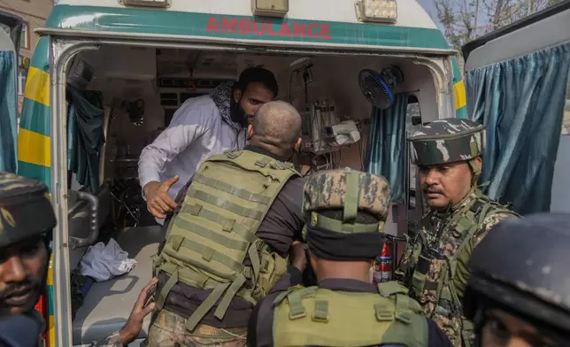 An injured Indian paramilitary soldier is taken to hospital for treatment during a gun battle, in Srinagar, Indian controlled Kashmir, Saturday, Nov. 2, 2024. (AP Photo/Mukhtar Khan)