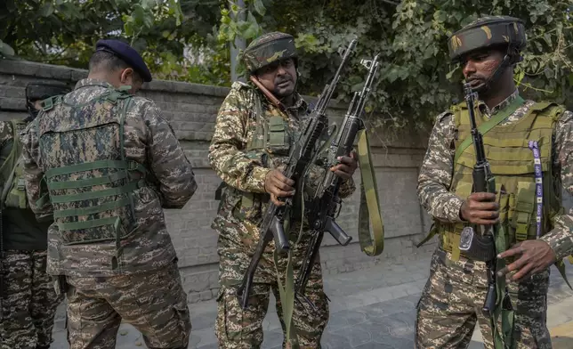 Indian paramilitary soldiers move towards the site of gun battle, in Srinagar, Indian controlled Kashmir, Saturday, Nov. 2, 2024. (AP Photo/Mukhtar Khan)