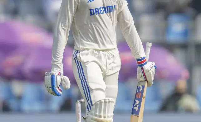 India's Shubman Gill reacts after scoring fifty runs during the second day of the third cricket test match between India and New Zealand at Wankhede Stadium, in Mumbai, India, Saturday, Nov. 2, 2024.(AP Photo/Rajanish Kakade)