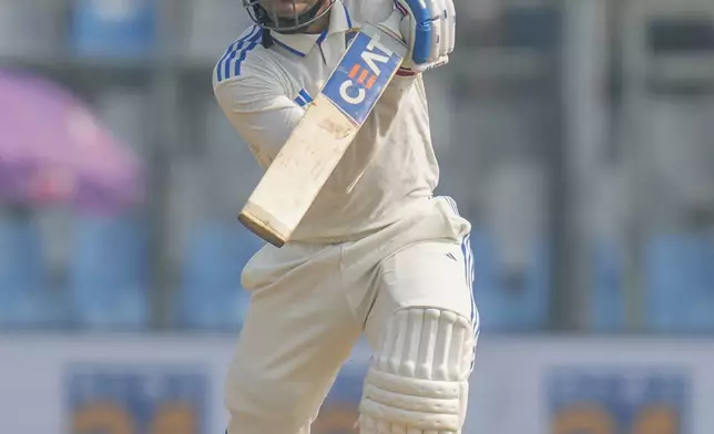 India's Shubman Gill plays a shot during the second day of the third cricket test match between India and New Zealand at Wankhede Stadium, in Mumbai, India, Saturday, Nov. 2, 2024.(AP Photo/Rajanish Kakade)