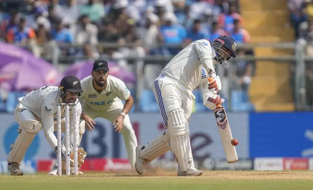 India's Rishab Pant plays a shot during the third day of the third cricket test match between India and New Zealand at Wankhede Stadium, in Mumbai, India, Sunday, Nov. 3, 2024.(AP Photo/Rajanish Kakade)