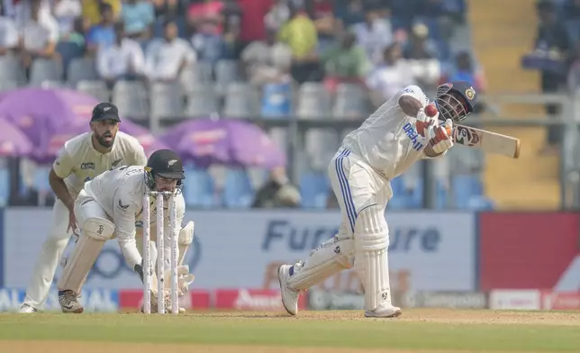 India's Rishab Pant plays a shot during the second day of the third cricket test match between India and New Zealand at Wankhede Stadium, in Mumbai, India, Saturday, Nov. 2, 2024.(AP Photo/Rajanish Kakade)