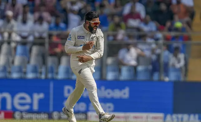 New Zealand's Aijaz Patel celebrates the dismissal of India's Virat Kohli during the third day of the third cricket test match between India and New Zealand at Wankhede Stadium, in Mumbai, India, Sunday, Nov. 3, 2024.(AP Photo/Rajanish Kakade)