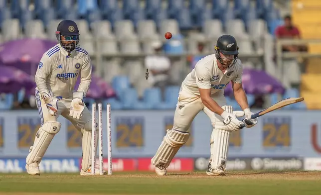 New Zealand's Glenn Phillips is bowled out by India's Ravichandran Ashwin during the second day of the third cricket test match between India and New Zealand at Wankhede Stadium, in Mumbai, India, Saturday, Nov. 2, 2024.(AP Photo/Rajanish Kakade)