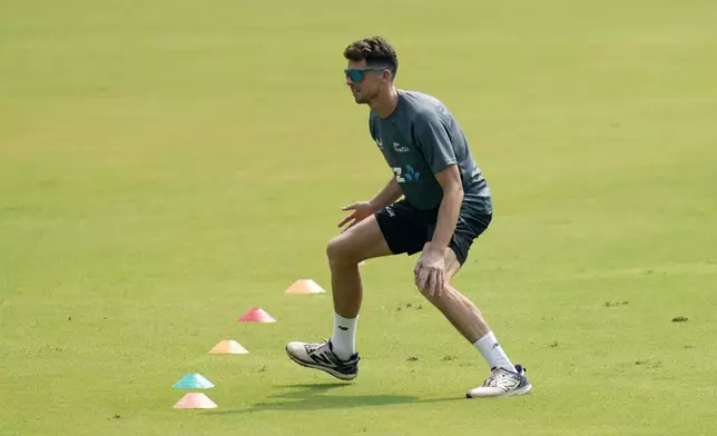 New Zealand's Mitchell Santner takes part in a practice session before the third test match against India, in Mumbai, India, Thursday, Oct. 31, 2024. (AP Photo/Rajanish Kakade)