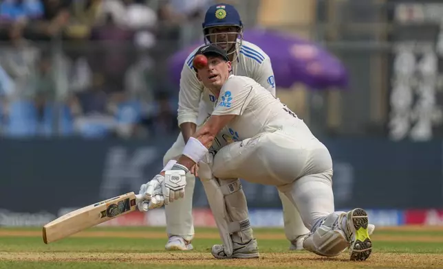 New Zealand's Will Young watches at the ball after playing a shot during the first day of the third cricket test match between India and New Zealand at Wankhede Stadium, in Mumbai, India, Friday, Nov. 1, 2024.(AP Photo/Rajanish Kakade)