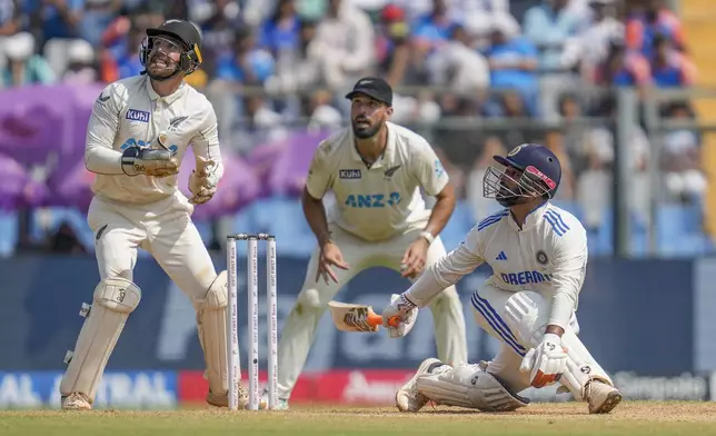 India's Rishab Pant watches the ball after playing a shot during the third day of the third cricket test match between India and New Zealand at Wankhede Stadium, in Mumbai, India, Sunday, Nov. 3, 2024.(AP Photo/Rajanish Kakade)