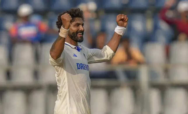 India's Ravindra Jadeja celebrates the dismissal of New Zealand's Ish Sodhi during the second day of the third cricket test match between India and New Zealand at Wankhede Stadium, in Mumbai, India, Saturday, Nov. 2, 2024.(AP Photo/Rajanish Kakade)