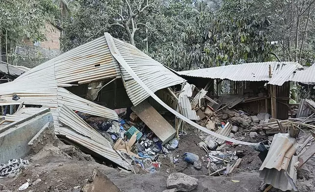 Houses are seen damaged from the eruption of Mount Lewotobi Laki-Laki in East Flores, Indonesia, Monday, Nov. 4, 2024. (AP Photo)