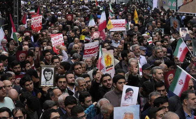 Iranians attend an annual rally in front of the former U.S. Embassy in Tehran, Iran, Sunday, Nov. 3, 2024, marking the 45th anniversary of Iranian students' takeover of the embassy, starting a hostage crisis. (AP Photo/Vahid Salemi)