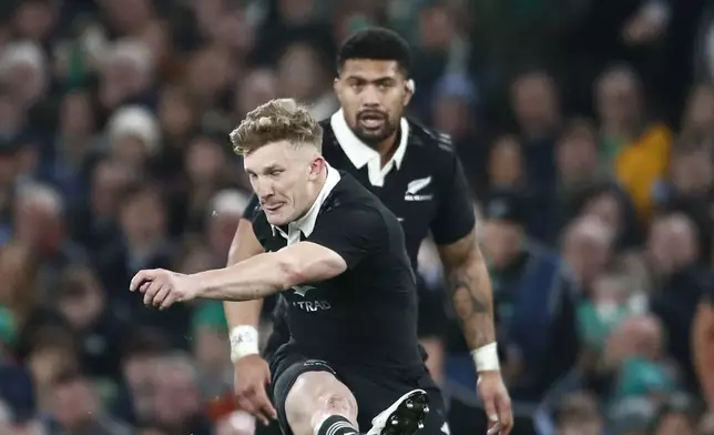 New Zealand's Damian McKenzie, kicks a penalty during the the Autumn Nations series rugby union match between Ireland and New Zealand at the Aviva Stadium in Dublin, Ireland, Friday, Nov. 8, 2024. (AP Photo/Peter Morrison)