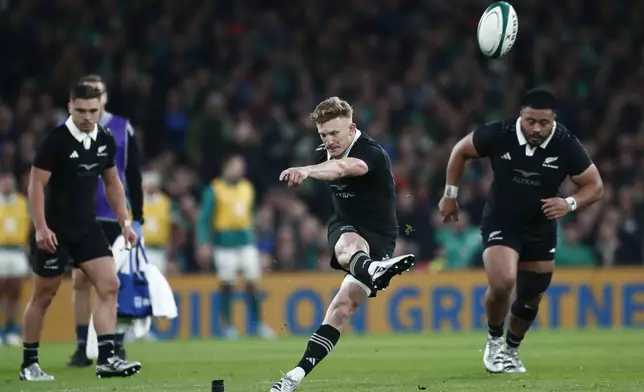 New Zealand's Damian McKenzie, takes a penalty kick during the the Autumn Nations series rugby union match between Ireland and New Zealand at the Aviva Stadium in Dublin, Ireland, Friday, Nov. 8, 2024. (AP Photo/Peter Morrison)