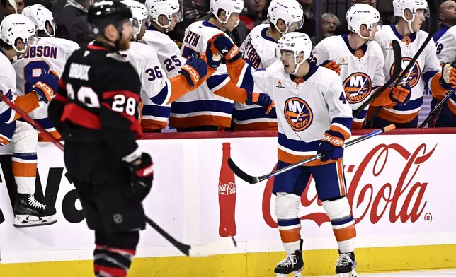 New York Islanders centre Jean-Gabriel Pageau (44) celebrates a goal as Ottawa Senators right wing Claude Giroux (28) skates away, during second period NHL hockey action in Ottawa, on Thursday, Nov. 7, 2024. (Justin Tang/The Canadian Press via AP)