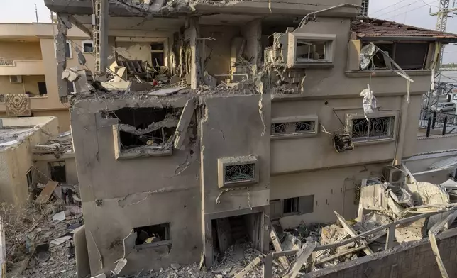 A view of a damaged home after projectiles fired from Lebanon in Tira, central Israel, Saturday, Nov. 2, 2024. (AP Photo/Ariel Schalit)