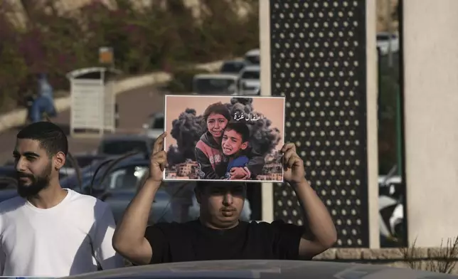 Palestinian citizens of Israel protest against Israel's military operations in the Gaza Strip and Lebanon, in Umm Al-Fahm, Israel, Saturday, Nov. 9, 2024. (AP Photo/Mahmoud Illean)