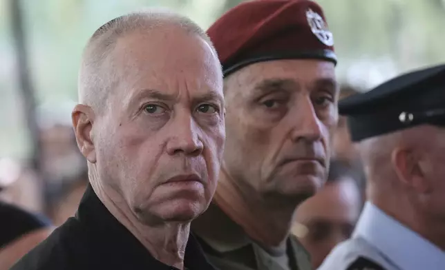 Israel's Defense Minister Yoav Gallant, left, and Chief of the General Staff Lieutenant-General Herzi Halevi, attend a ceremony marking the Hebrew calendar anniversary of the Hamas attack on October 7 last year that sparked the ongoing war in Gaza, at the Mount Herzl military cemetery in Jerusalem, Israel Sunday Oct. 27, 2024. (Gil Cohen-Magen/Pool Photo via AP)