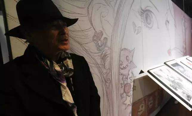 Artist Yoshitaka Amano attends the press preview of the exhibition "Amano Corpus Animae", celebrating his 50-year-long career, at the Fabbrica del Vapore, in Milan, Italy, Tuesday, Nov. 12, 2024. (AP Photo/Luca Bruno)