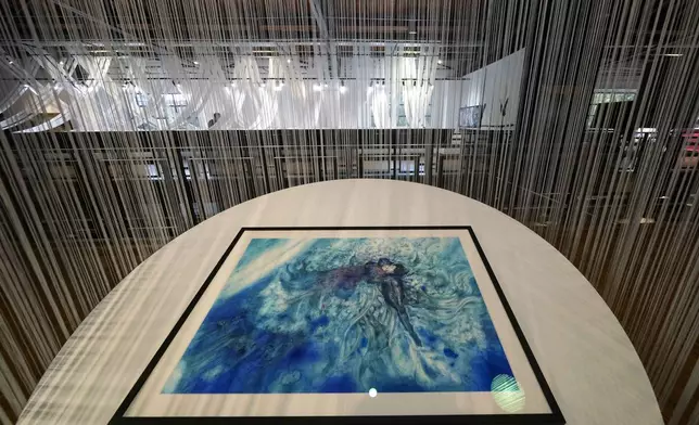 Creations of artist Yoshitaka Amano are displayed during the press preview of the exhibition "Amano Corpus Animae", celebrating his 50-year-long career, at the Fabbrica del Vapore, in Milan, Italy, Tuesday, Nov. 12, 2024. (AP Photo/Luca Bruno)