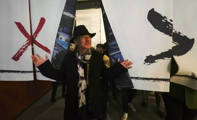 Artist Yoshitaka Amano attends the press preview of the exhibition "Amano Corpus Animae", celebrating his 50-year-long career, at the Fabbrica del Vapore, in Milan, Italy, Tuesday, Nov. 12, 2024. (AP Photo/Luca Bruno)