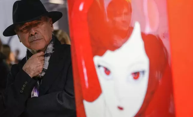 Artist Yoshitaka Amano attends the press preview of the exhibition "Amano Corpus Animae", celebrating his 50-year-long career, at the Fabbrica del Vapore, in Milan, Italy, Tuesday, Nov. 12, 2024. (AP Photo/Luca Bruno)