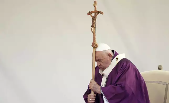 Pope Francis presides over a ceremony on the occasion of All Souls Day, at the Laurentino cemetery in the outskirts of Rome, Saturday, Nov. 2, 2024. (AP Photo/Andrew Medichini)