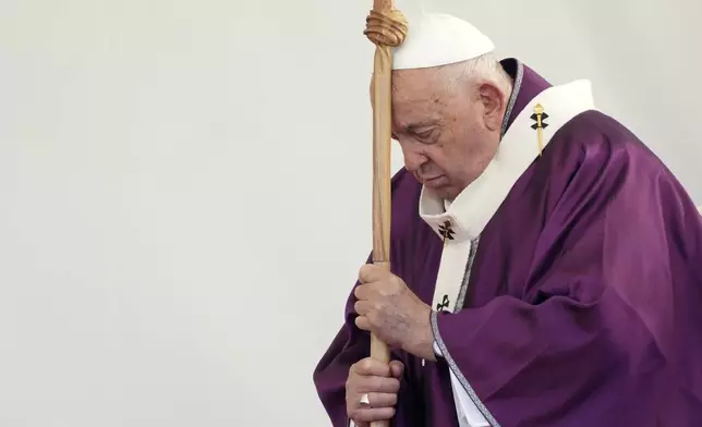 Pope Francis presides over a ceremony on the occasion of All Souls Day, at the Laurentino cemetery in the outskirts of Rome, Saturday, Nov. 2, 2024. (AP Photo/Andrew Medichini)