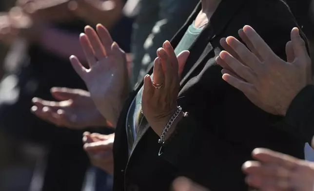 People pray during a mass with Pope Francis on the occasion of All Souls Day, at the Laurentino cemetery in the outskirts of Rome, Saturday, Nov. 2, 2024. (AP Photo/Andrew Medichini)