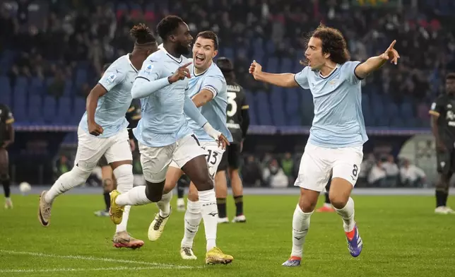 Lazio's Boulaye Dia, left, celebrates after scoring the opening goal during a Serie A soccer match between Lazio and Cagliari, at Rome's Olympic stadium, Monday, Nov. 4, 2024. (AP Photo/Alessandra Tarantino)