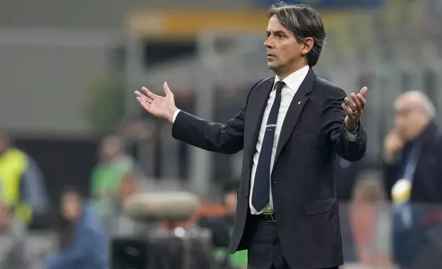 Inter Milan's head coach Simone Inzaghi follows the game during the Serie A soccer match between Inter Milan and Venezia at the San Siro Stadium, in Milan, Italy, Sunday, Nov. 3, 2024. (AP Photo/Antonio Calanni)