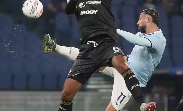 Lazio's Taty Castellanos, right, and Cagliari's Sebastiano Luperto vie for the ball during a Serie A soccer match between Lazio and Cagliari, at Rome's Olympic stadium, Monday, Nov. 4, 2024. (AP Photo/Alessandra Tarantino)