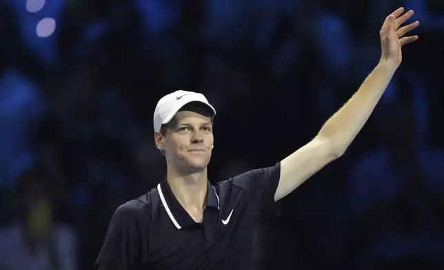 Italy's Jannik Sinner celebrates after winning the singles tennis match of the ATP World Tour Finals against Australia's Alex de Minaur, at the Inalpi Arena, in Turin, Italy, Sunday, Nov. 10, 2024. (AP Photo/Antonio Calanni)