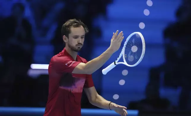 Russia's Daniil Medvedev reacts during the singles tennis match of the ATP World Tour Finals against United States' Taylor Fritz, at the Inalpi Arena, in Turin, Italy, Sunday, Nov. 10, 2024. (AP Photo/Antonio Calanni)