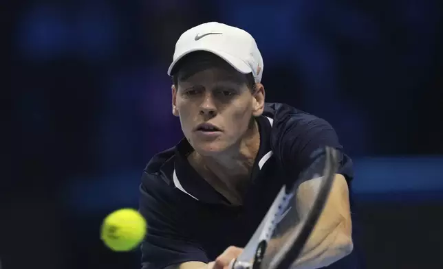 Italy's Jannik Sinner returns the ball to United States' Taylor Fritz during their singles tennis match of the ATP World Tour Finals at the Inalpi Arena, in Turin, Italy, Tuesday, Nov. 12, 2024. (AP Photo/Antonio Calanni)