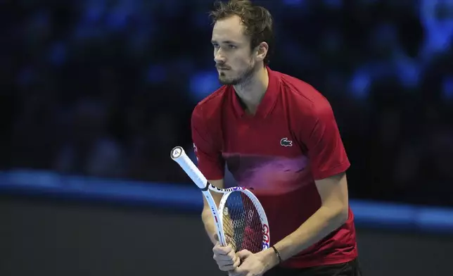 Russia's Daniil Medvedev reacts during the singles tennis match of the ATP World Tour Finals against United States' Taylor Fritz, at the Inalpi Arena, in Turin, Italy, Sunday, Nov. 10, 2024. (AP Photo/Antonio Calanni)