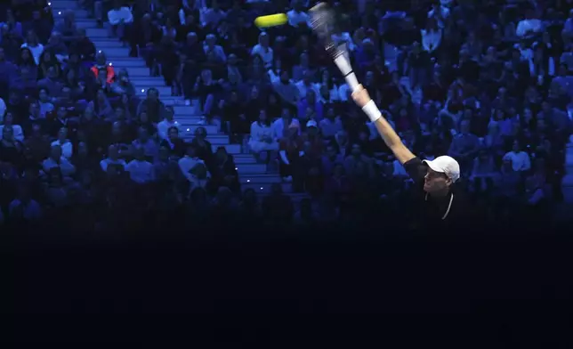 Italy's Jannik Sinner returns the ball to United States' Taylor Fritz during their singles tennis match of the ATP World Tour Finals at the Inalpi Arena, in Turin, Italy, Tuesday, Nov. 12, 2024. (AP Photo/Antonio Calanni)