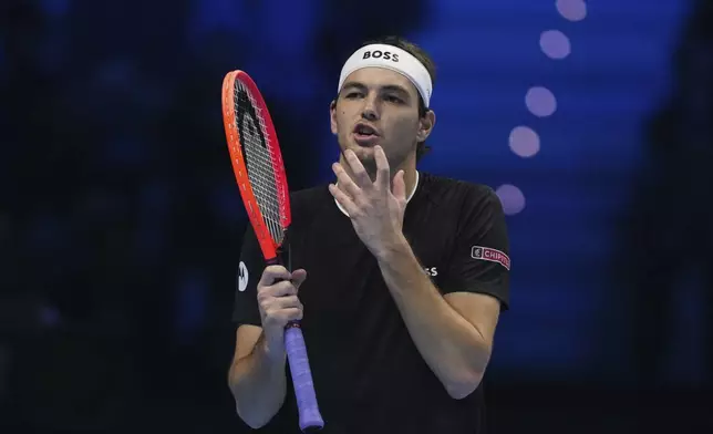 United States' Taylor Fritz reacts during the singles tennis match of the ATP World Tour Finals against Italy's Jannik Sinner, at the Inalpi Arena, in Turin, Italy, Tuesday, Nov. 12, 2024. (AP Photo/Antonio Calanni)