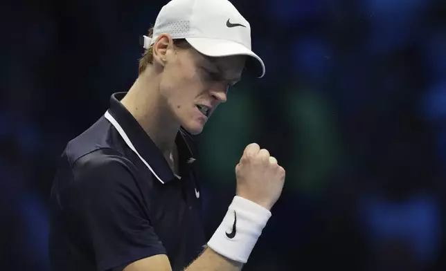 Italy's Jannik Sinner reacts during the singles tennis match of the ATP World Tour Finals against United States' Taylor Fritz, at the Inalpi Arena, in Turin, Italy, Tuesday, Nov. 12, 2024. (AP Photo/Antonio Calanni)